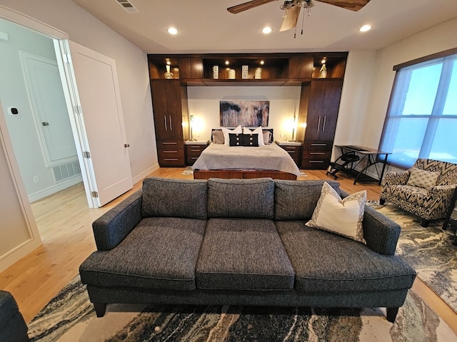 bedroom featuring light wood-type flooring and ceiling fan