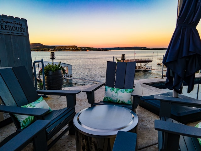 patio terrace at dusk with a water view