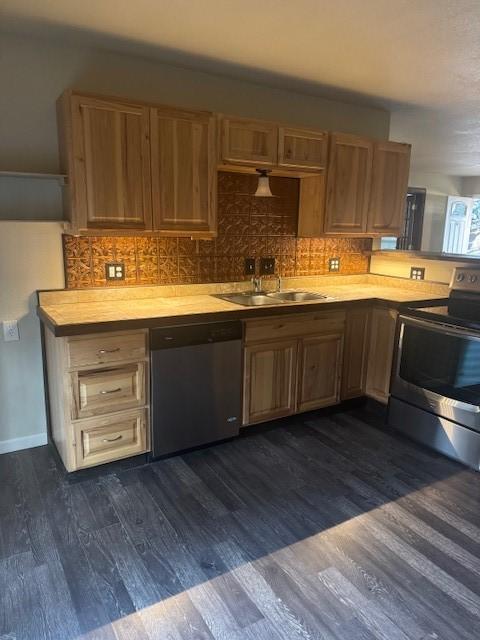 kitchen with backsplash, dark wood-type flooring, sink, appliances with stainless steel finishes, and butcher block counters