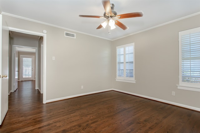 unfurnished room with dark wood-type flooring, ceiling fan, and a wealth of natural light