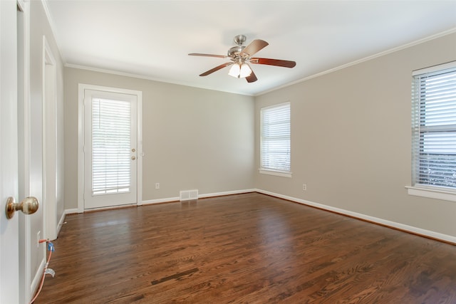 unfurnished room with ornamental molding, dark wood-type flooring, and ceiling fan