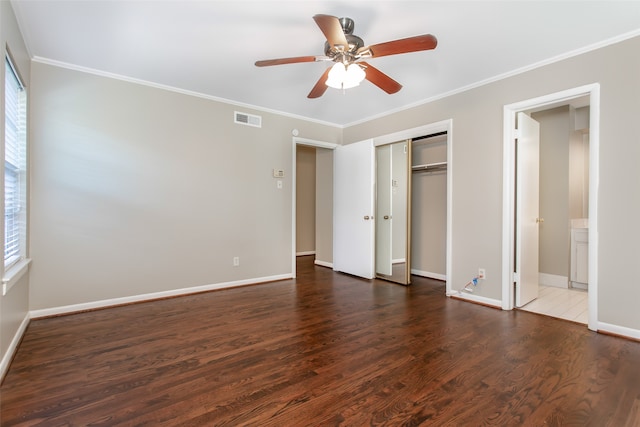 unfurnished bedroom with multiple windows, ceiling fan, dark hardwood / wood-style floors, and crown molding