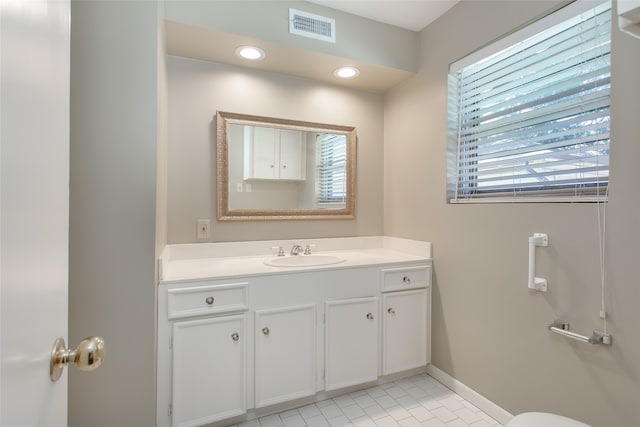 bathroom featuring vanity, tile patterned floors, and a wealth of natural light