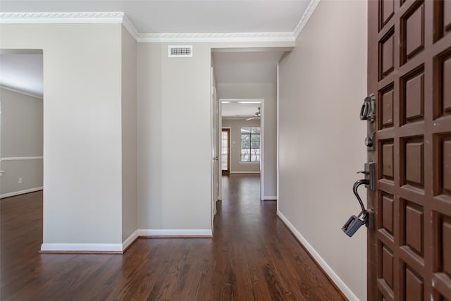 interior space with ornamental molding, dark hardwood / wood-style flooring, and ceiling fan