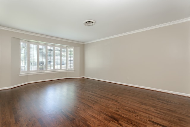 empty room with ornamental molding and dark wood-type flooring