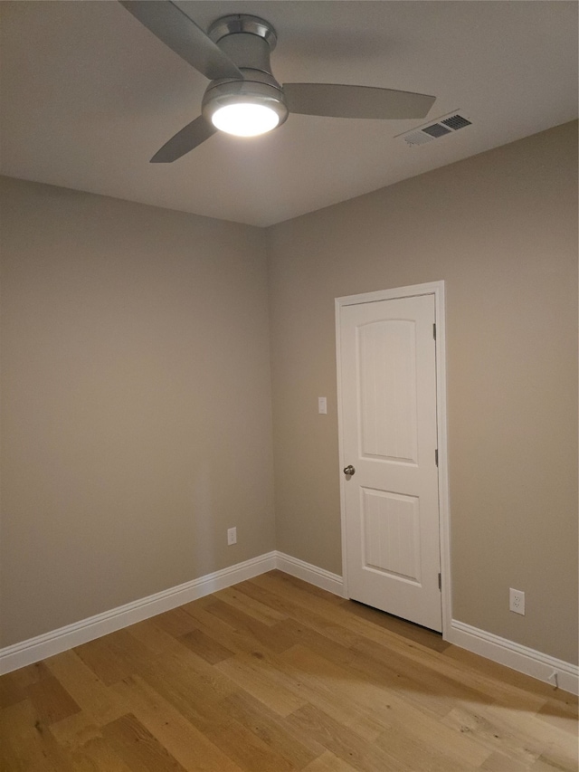 unfurnished room featuring ceiling fan and light hardwood / wood-style flooring