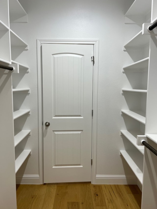 walk in closet featuring light hardwood / wood-style floors