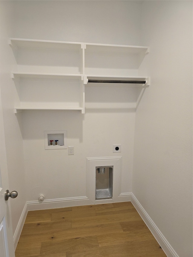 laundry area featuring washer hookup, hookup for an electric dryer, hookup for a gas dryer, and hardwood / wood-style floors