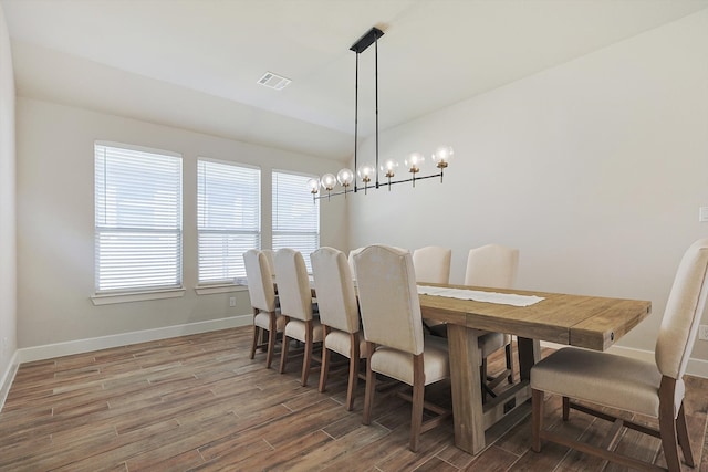 dining area featuring dark hardwood / wood-style flooring