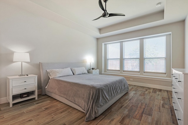 bedroom featuring ceiling fan and dark hardwood / wood-style flooring