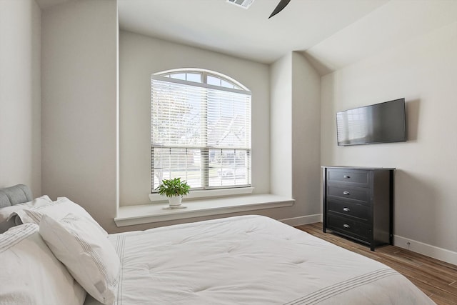 bedroom featuring dark hardwood / wood-style floors and ceiling fan