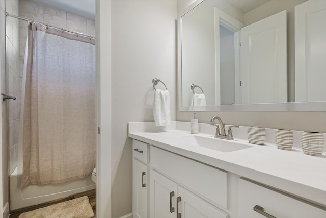 full bathroom with shower / bathtub combination with curtain, vanity, and toilet