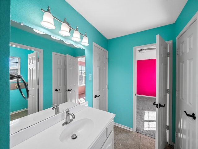 bathroom with tile patterned flooring and vanity