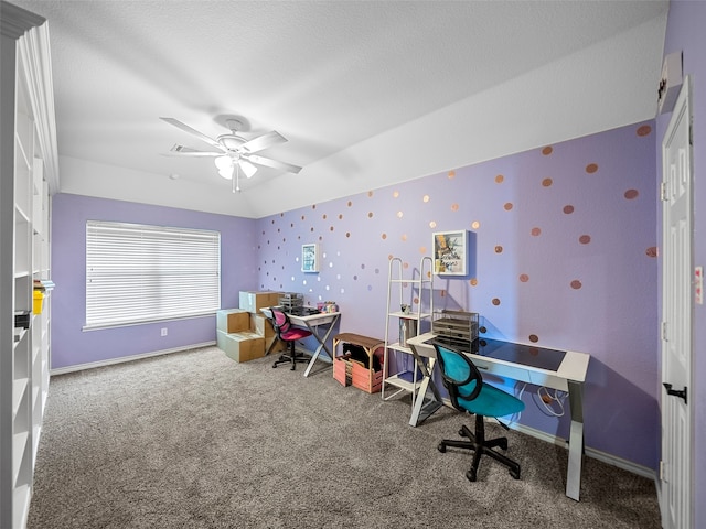 rec room with carpet, ceiling fan, and a textured ceiling