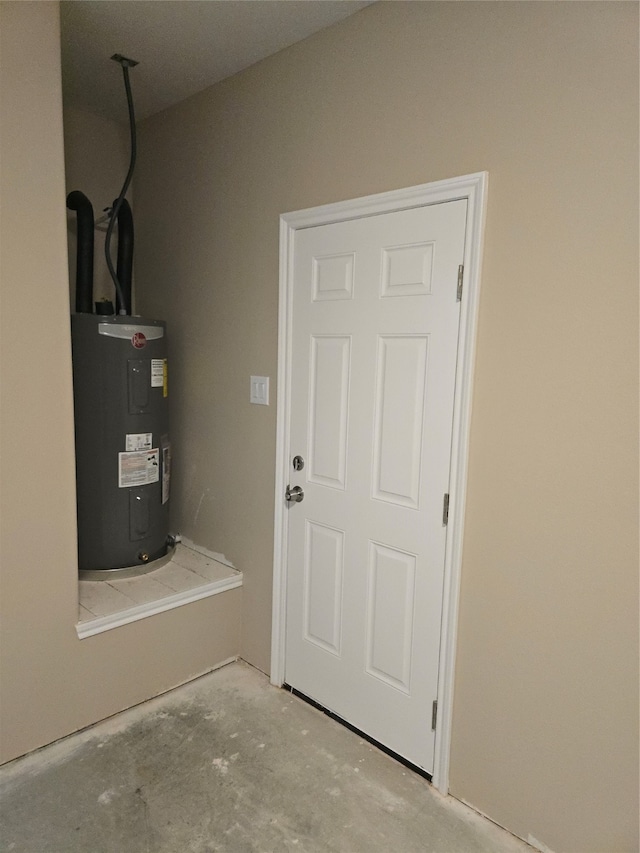 utility room with electric water heater