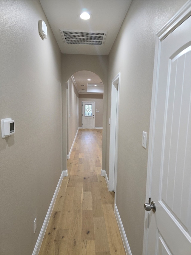 hall with light hardwood / wood-style flooring