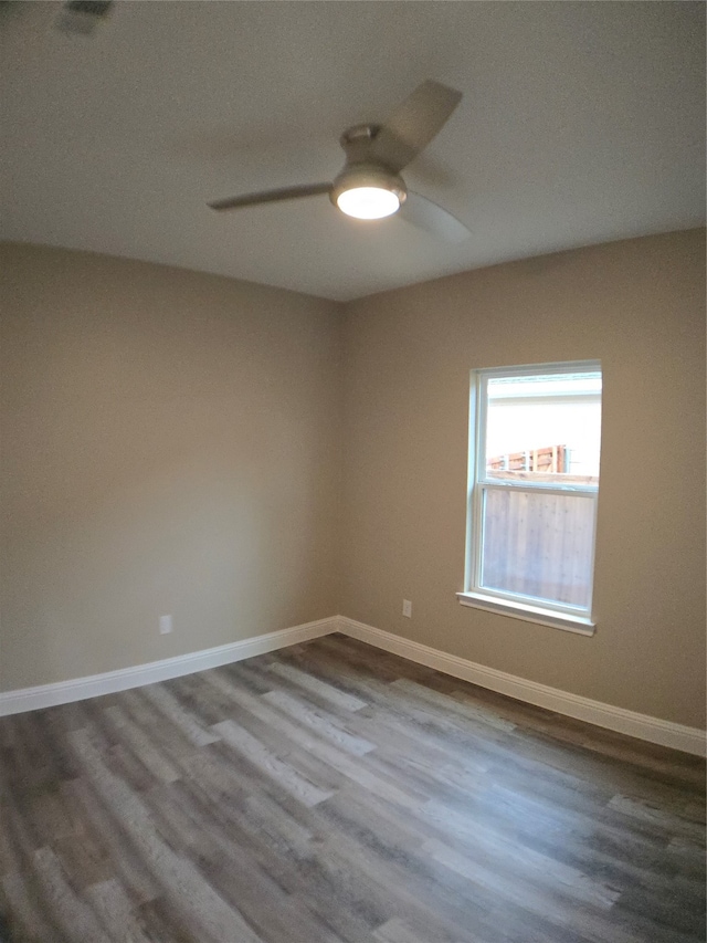 empty room with wood-type flooring and ceiling fan