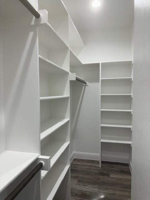 1010 S Preston St, Ennis, TX 75119 - spacious closet with dark wood-style flooring