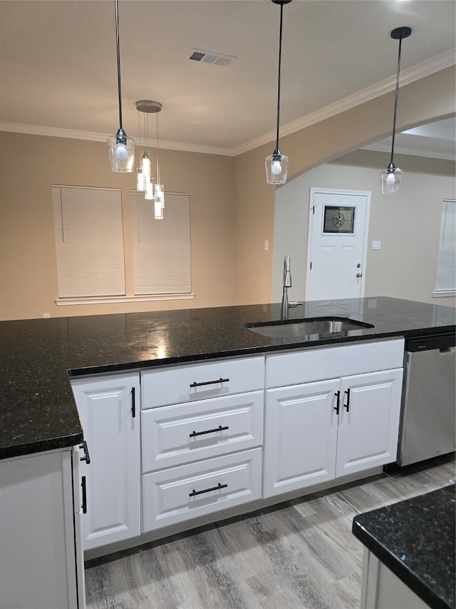 kitchen with dishwasher, white cabinetry, decorative light fixtures, and sink