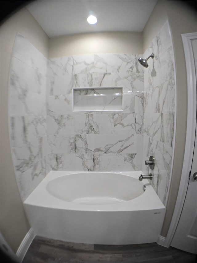 1010 S Preston St, Ennis, TX 75119 - bathroom featuring shower / bathtub combination, wood finished floors, baseboards, and recessed lighting