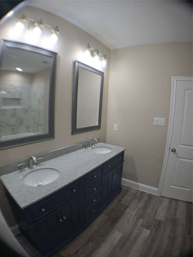 bathroom with vanity and hardwood / wood-style floors