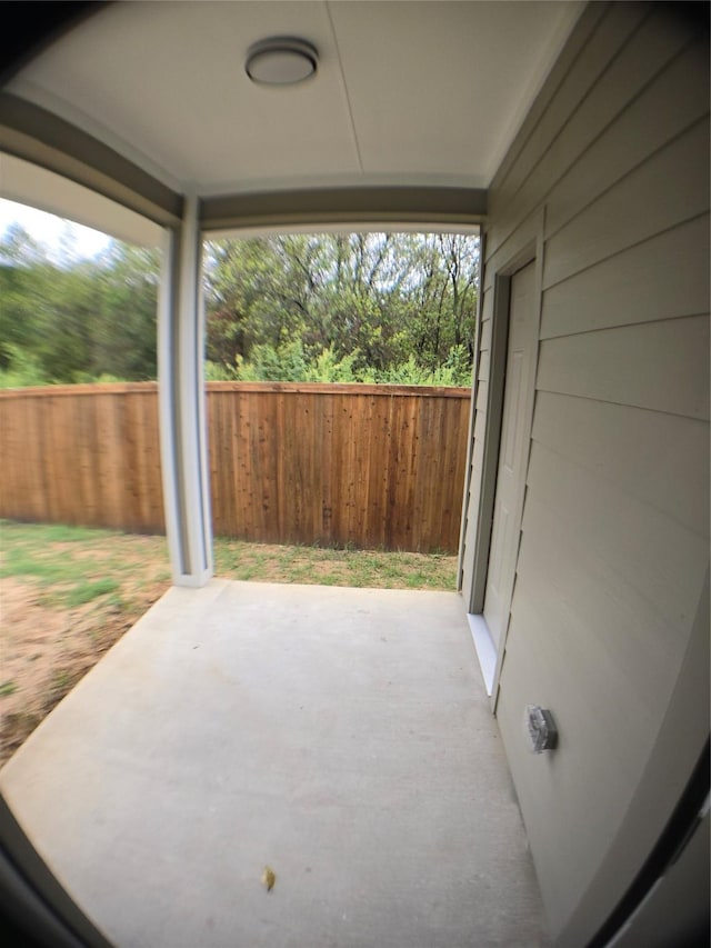 1010 S Preston St, Ennis, TX 75119 - fenced backyard with a patio