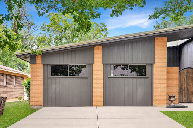 garage featuring wooden walls