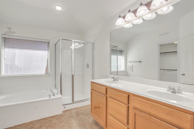 bathroom with vanity, shower with separate bathtub, and tile patterned floors