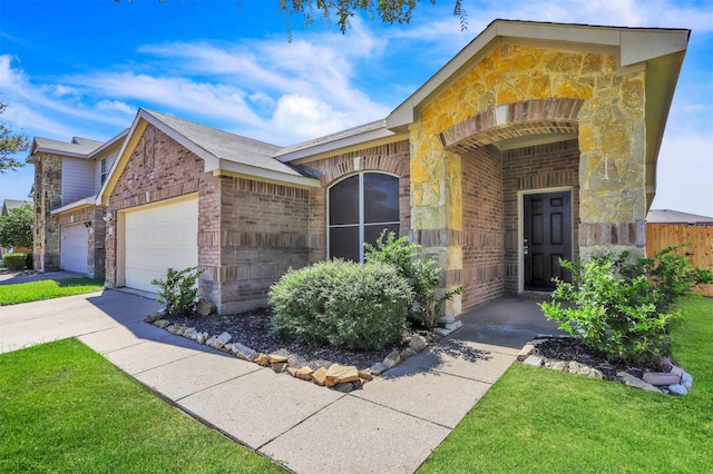 ranch-style house with a garage and a front lawn