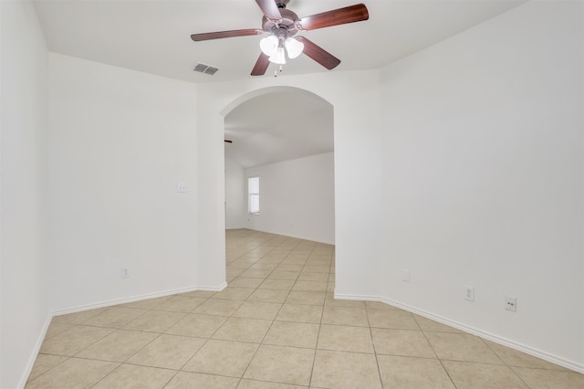 unfurnished room featuring ceiling fan and light tile patterned flooring