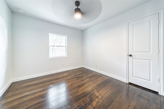 unfurnished room featuring dark hardwood / wood-style floors and ceiling fan