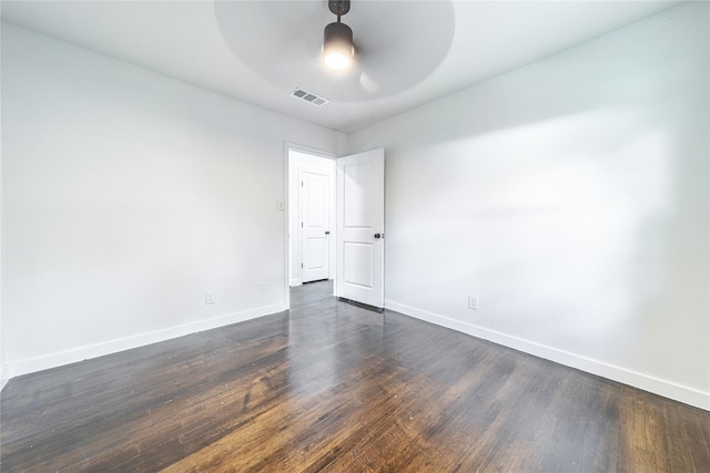 1504 Nichols St, Ennis, TX 75119 - spare room featuring ceiling fan and dark wood-style flooring