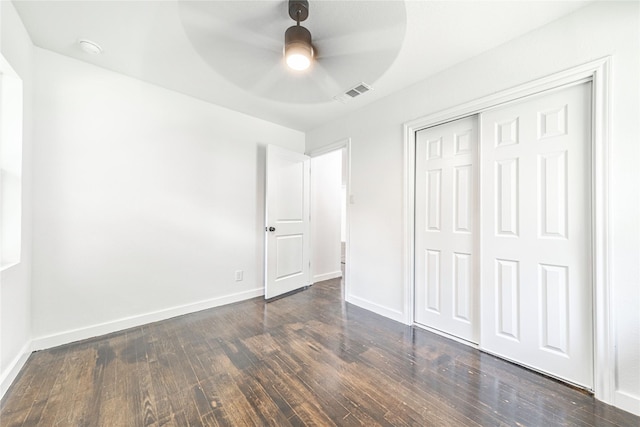1504 Nichols St, Ennis, TX 75119 - unfurnished bedroom featuring dark wood-type flooring, a closet, and ceiling fan