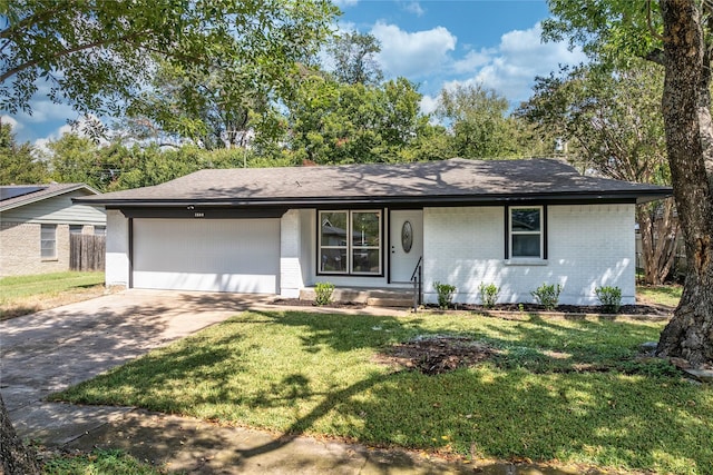 1504 Nichols St, Ennis, TX 75119 - view of front facade with brick siding, an attached garage, driveway, a front yard, and roof with shingles