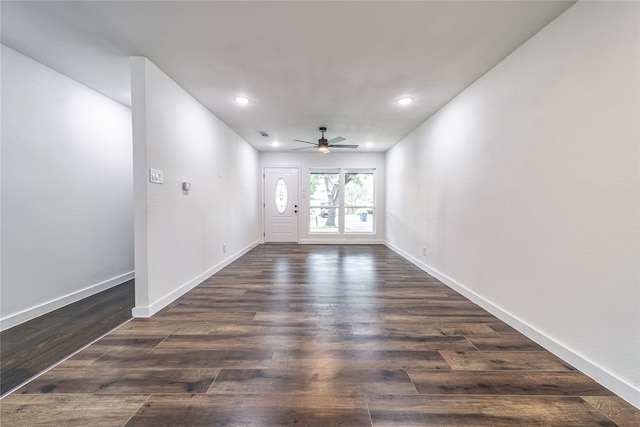 unfurnished room featuring ceiling fan and dark hardwood / wood-style floors