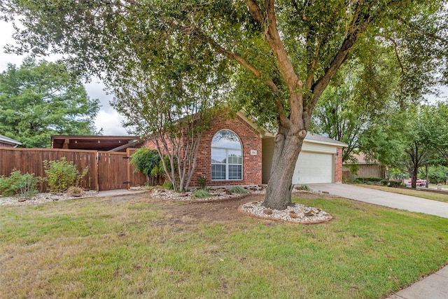 view of front of property with a garage and a front yard