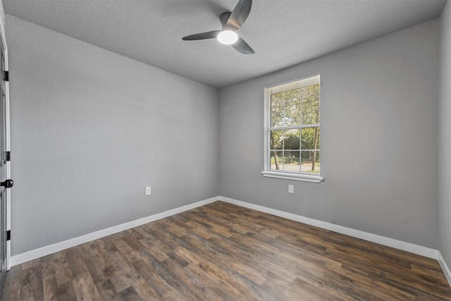 spare room featuring ceiling fan, a textured ceiling, and dark hardwood / wood-style floors