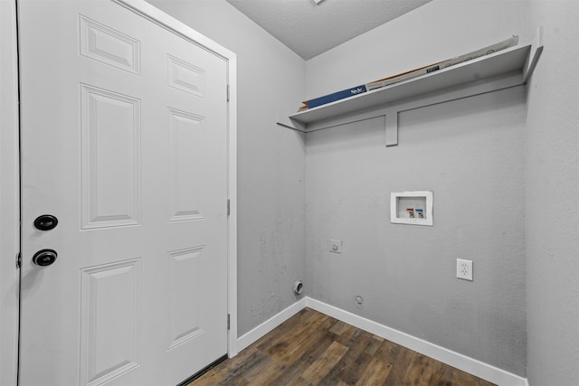 clothes washing area with a textured ceiling, electric dryer hookup, dark hardwood / wood-style flooring, hookup for a washing machine, and gas dryer hookup