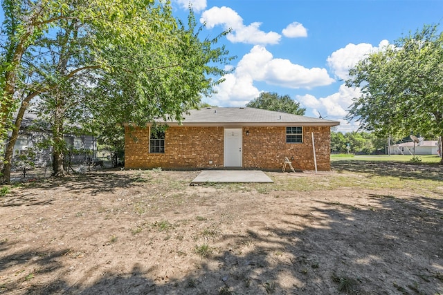 back of property with a patio area