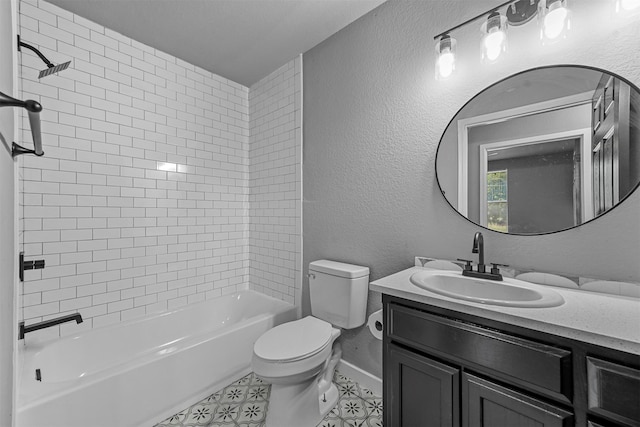 full bathroom with tiled shower / bath, vanity, and toilet