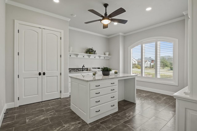 kitchen featuring a ceiling fan, open shelves, ornamental molding, baseboards, and white cabinets