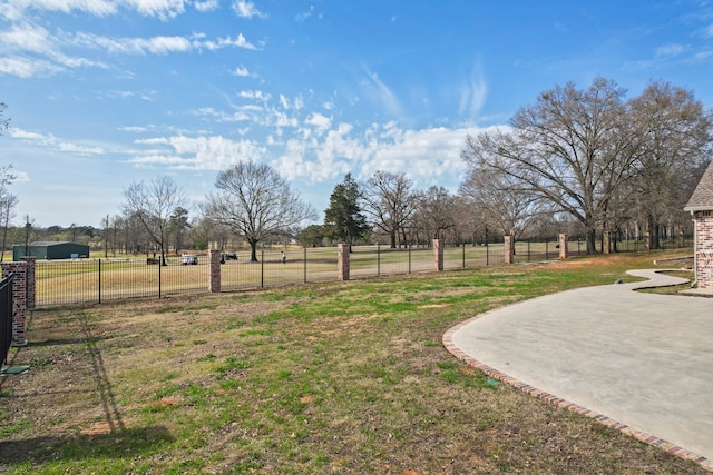 view of yard featuring a rural view and a patio