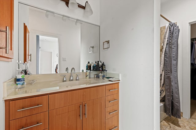 bathroom featuring shower / bath combo and vanity