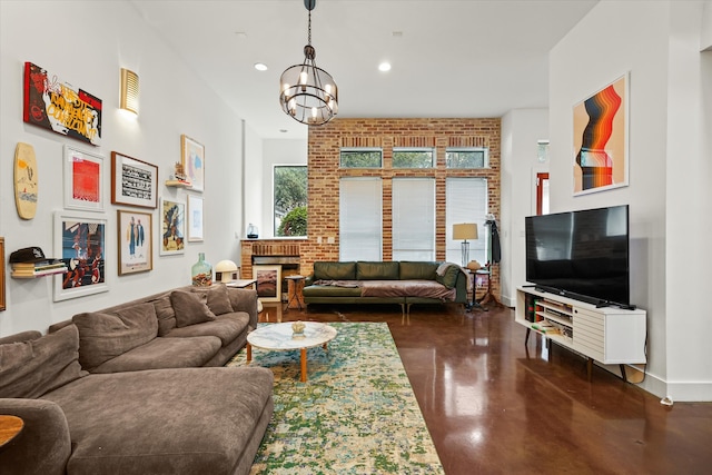 living room featuring a fireplace and a chandelier