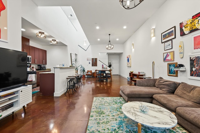 living room with a notable chandelier