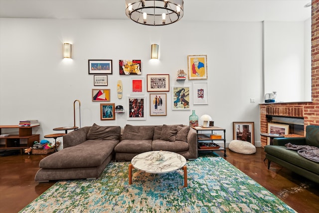 living room with a fireplace and a chandelier