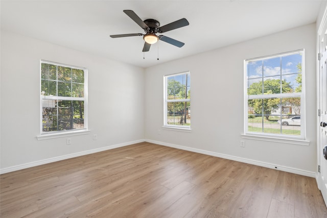 empty room with light hardwood / wood-style floors and ceiling fan