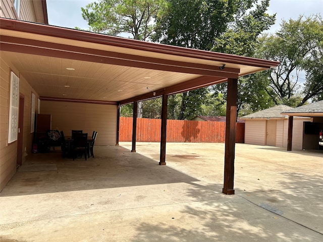 view of parking / parking lot featuring a carport