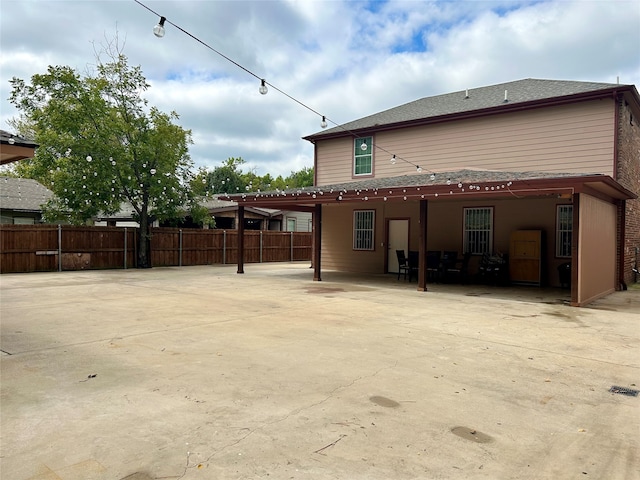 back of property with a patio