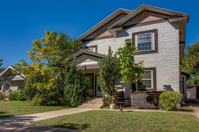 view of front of home with a front lawn